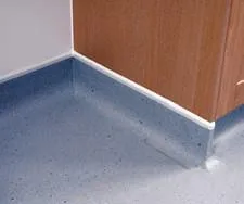 Fig 3. Close-up of a sealed vinyl floor finish coved continuously up the wall with no gap or crevice at the junction.