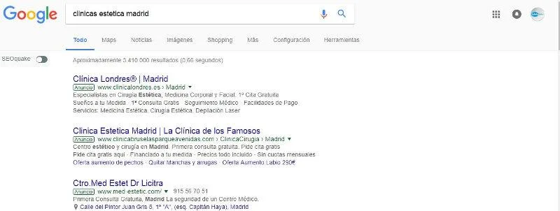 Fig 6. Spanish search-engine results page for "clinicas estetica madrid": three paid clinic advertisements leading with hooks such as free first consultation, financing, and a fixed price for lip augmentation.
