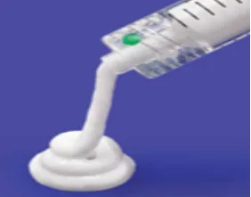 Fig 3. An opaque semisolid injectable (non-HA / collagen-stimulating class) extruded from a syringe, illustrating the material diversity of the injectable shelf.